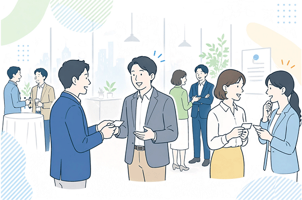 経営者が交流会で名刺交換し会話をしている様子