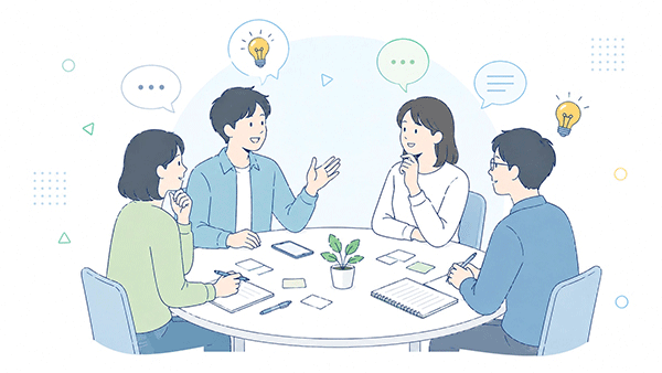個人事業主同士がテーブルを囲んで集客の悩みを相談し合う場面